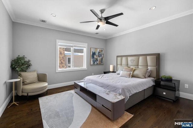 bedroom featuring crown molding, ceiling fan, and dark hardwood / wood-style floors