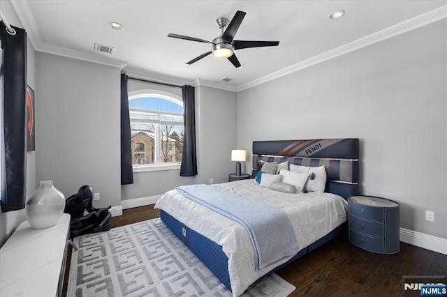 bedroom featuring crown molding, dark wood-type flooring, and ceiling fan