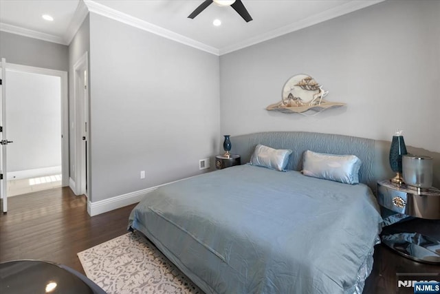 bedroom with ornamental molding, dark wood-type flooring, and ceiling fan