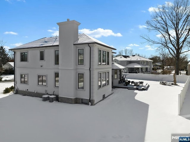 view of snow covered house