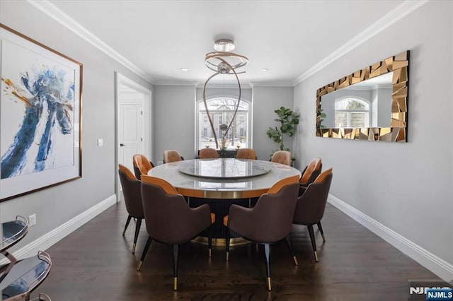 dining area with dark hardwood / wood-style flooring, crown molding, and a healthy amount of sunlight