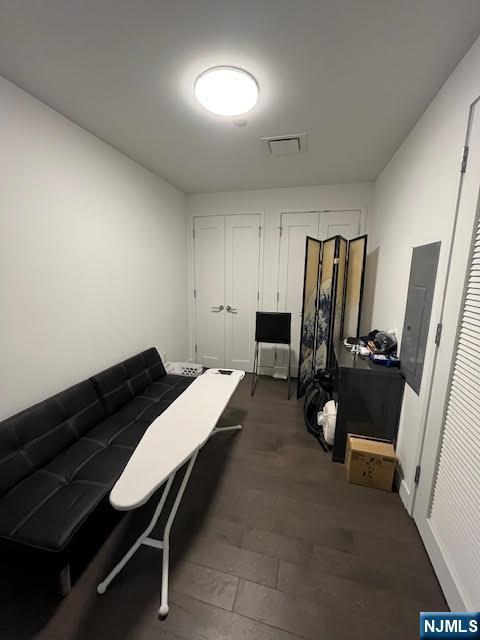 interior space featuring dark hardwood / wood-style floors and electric panel