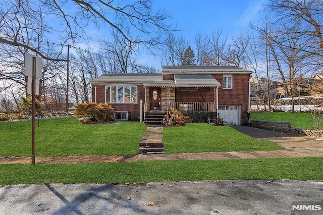 view of front of home with a garage and a front yard