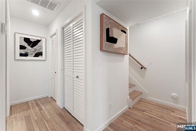 corridor featuring light wood-type flooring