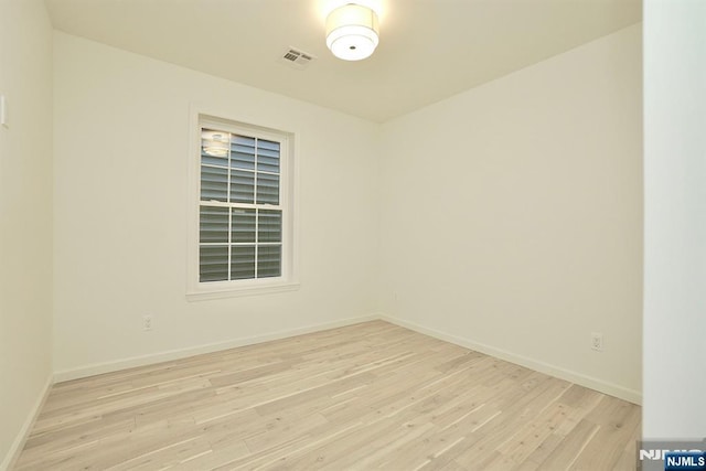 unfurnished room featuring light wood-type flooring