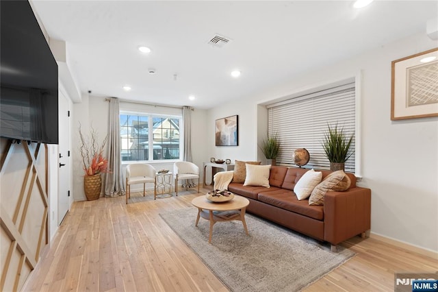 living room with light hardwood / wood-style floors