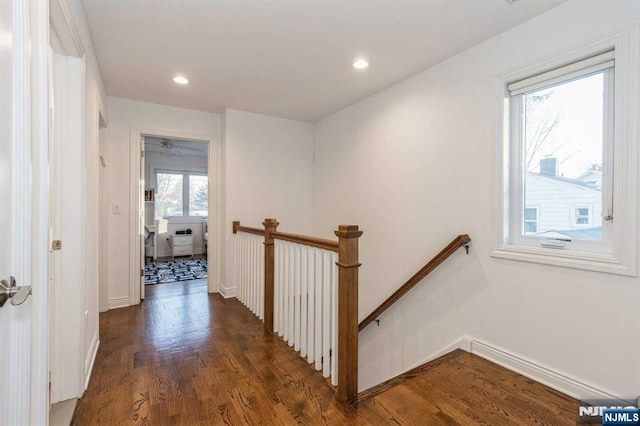 hall with dark wood-type flooring