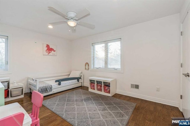 bedroom featuring ceiling fan and dark hardwood / wood-style flooring