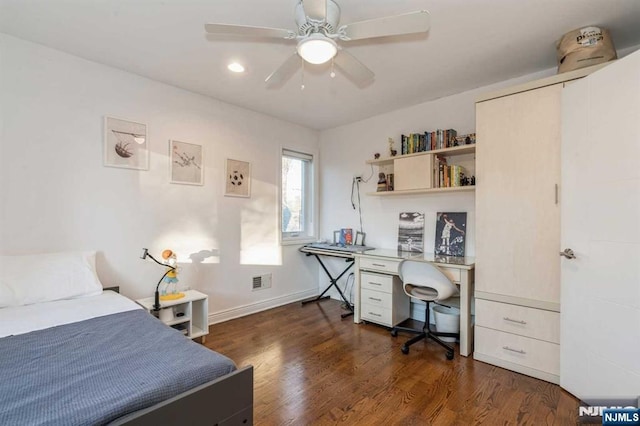 bedroom with dark hardwood / wood-style floors and ceiling fan