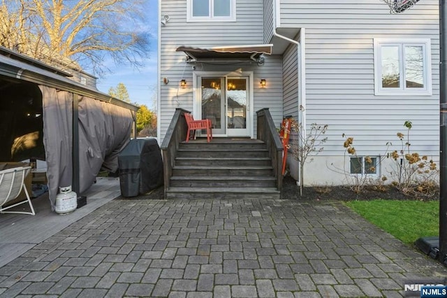 doorway to property featuring a patio