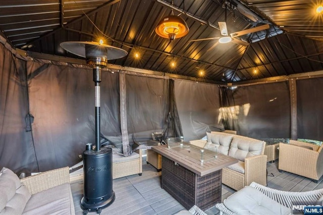 view of patio featuring a gazebo, outdoor lounge area, and a deck