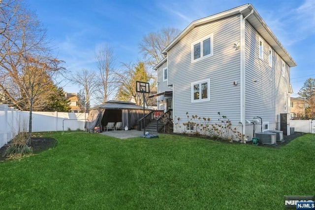 rear view of house with a yard and a patio area