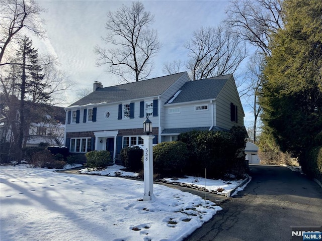 colonial home with a garage