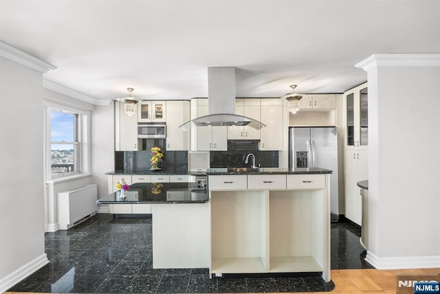 kitchen featuring white cabinetry, island exhaust hood, ornamental molding, and tasteful backsplash