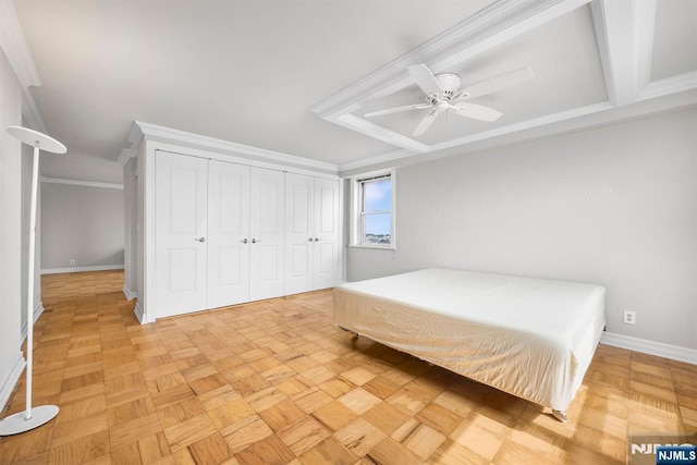 unfurnished bedroom featuring light parquet floors, crown molding, and ceiling fan