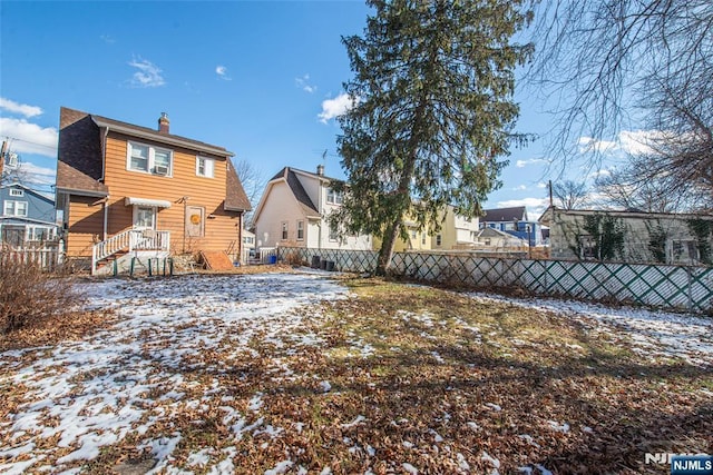 view of snow covered house