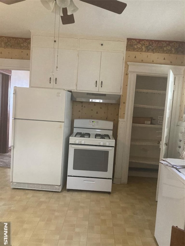 kitchen featuring ceiling fan, white appliances, and white cabinets