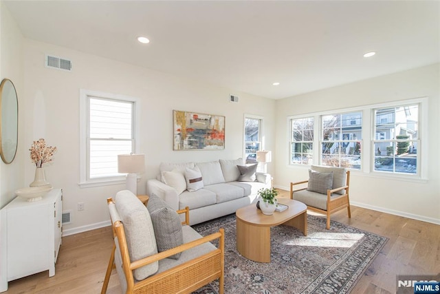 living room with light hardwood / wood-style floors