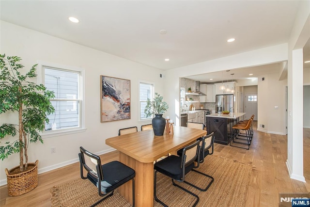 dining room with light wood-type flooring