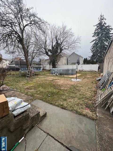 view of yard featuring a trampoline