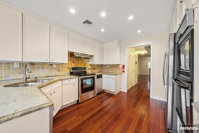 kitchen featuring sink, white cabinetry, dark hardwood / wood-style floors, stainless steel electric stove, and light stone countertops