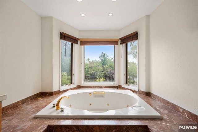 bathroom with tiled bath