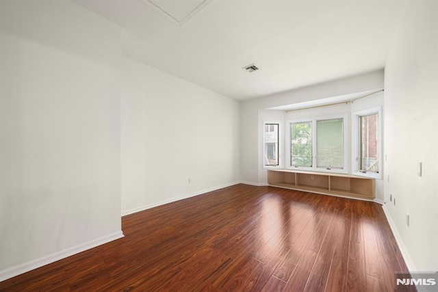 spare room featuring hardwood / wood-style flooring