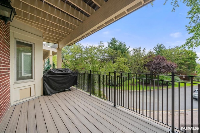 wooden deck with grilling area