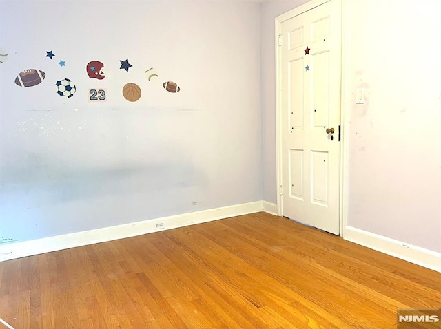 empty room featuring hardwood / wood-style flooring