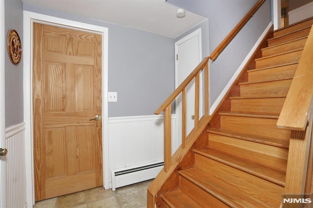 foyer with a baseboard heating unit