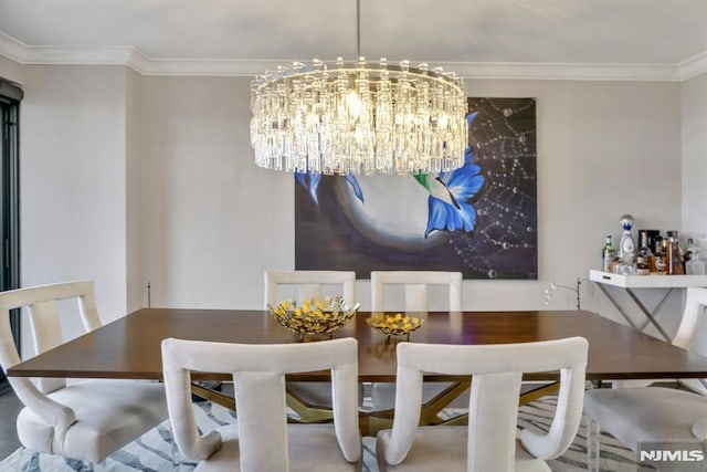 dining room featuring ornamental molding and a chandelier