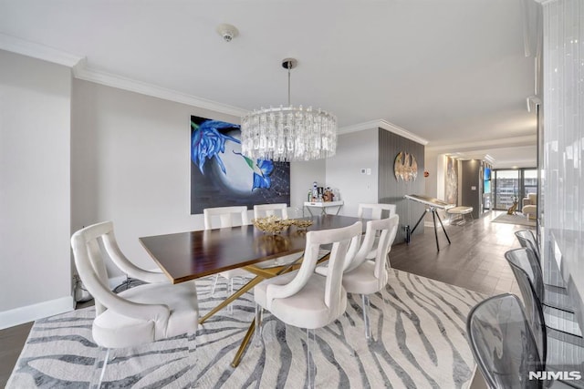 dining room with crown molding and a chandelier