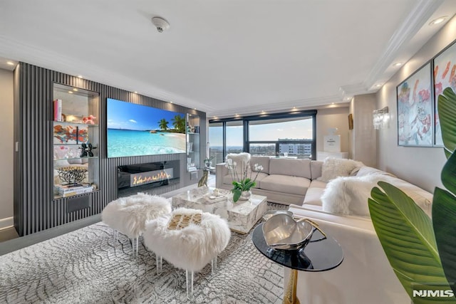 living room with crown molding and floor to ceiling windows