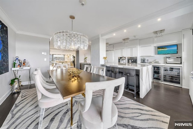 dining area with wine cooler, dark wood-type flooring, ornamental molding, and an inviting chandelier