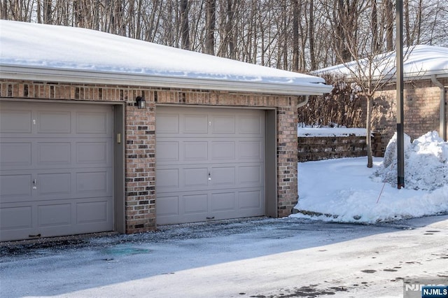 view of snow covered garage