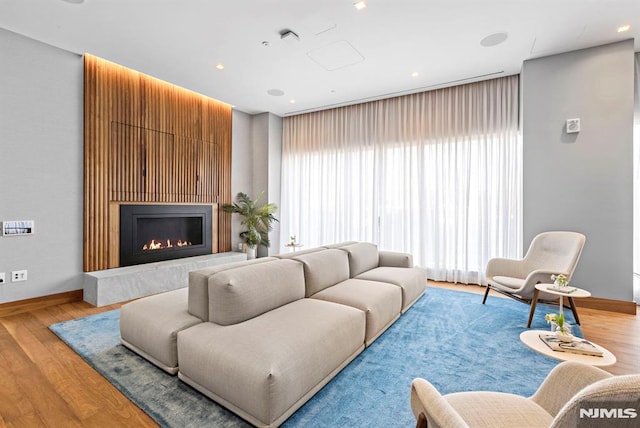 living room featuring plenty of natural light and light wood-type flooring