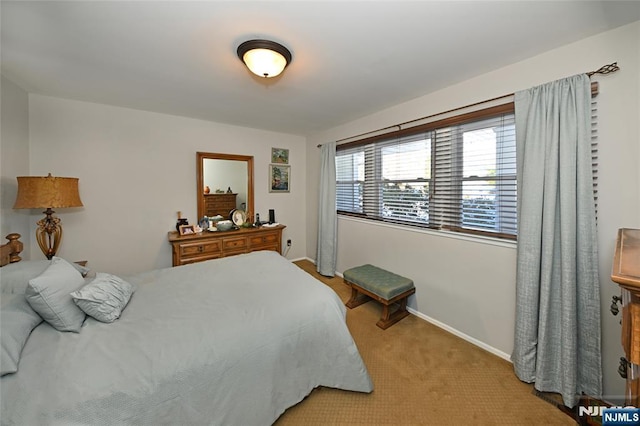 bedroom with light colored carpet