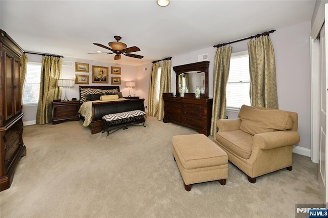 carpeted bedroom featuring ceiling fan