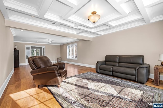 living room with crown molding, coffered ceiling, light hardwood / wood-style floors, and beam ceiling