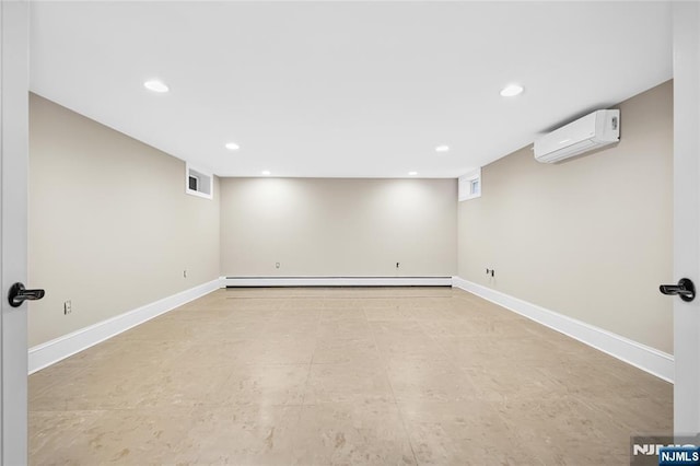 basement featuring a wall mounted air conditioner and baseboard heating