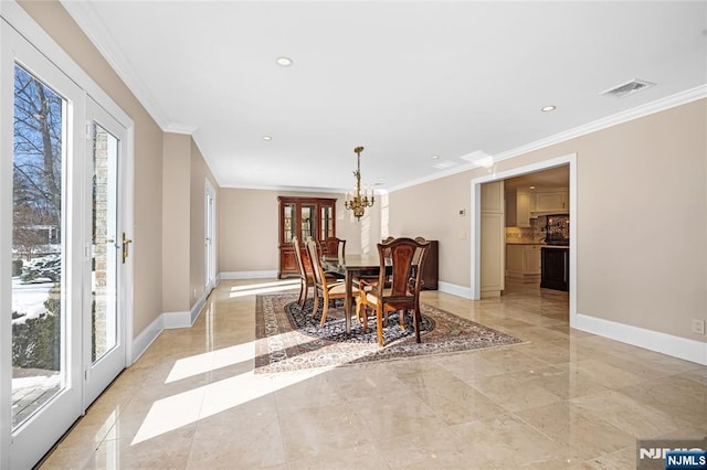 dining area with french doors and ornamental molding