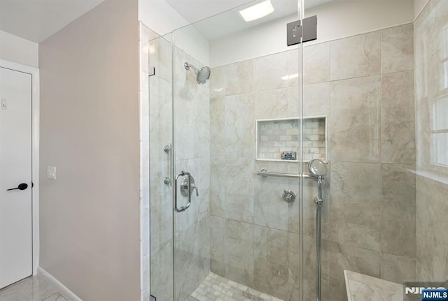 bathroom with a shower with shower door