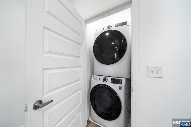 washroom with laundry area and stacked washing maching and dryer