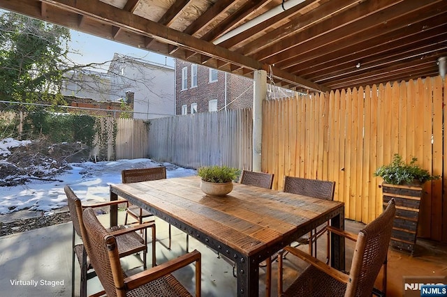 view of patio featuring fence private yard and outdoor dining area