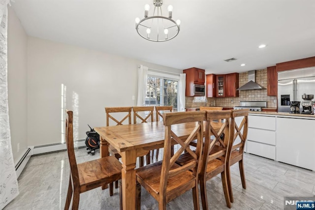 dining room featuring a baseboard heating unit and a notable chandelier