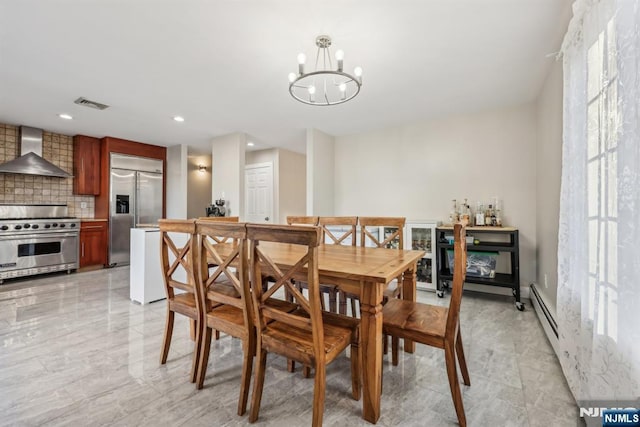 dining room featuring a notable chandelier