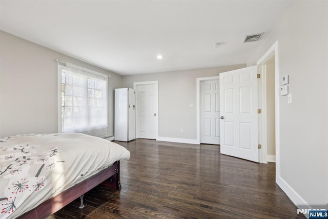 bedroom featuring dark wood-type flooring