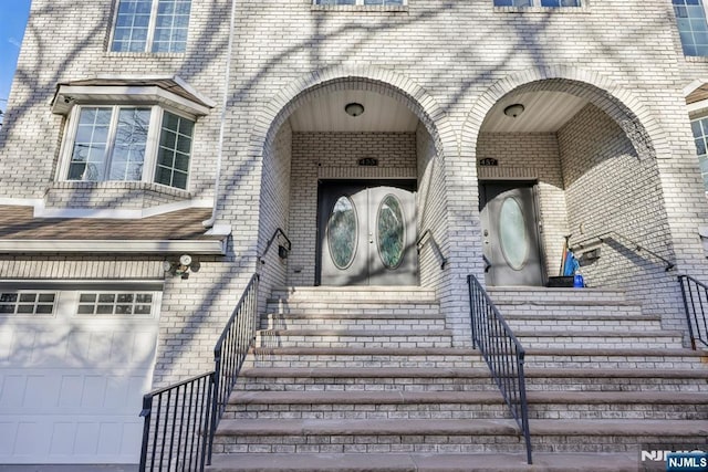 doorway to property featuring a garage