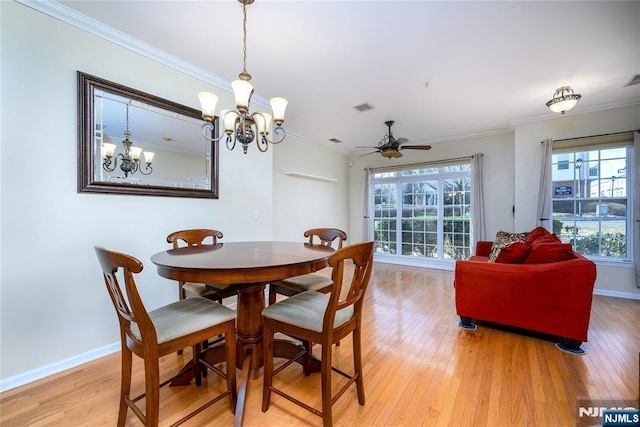 dining room with crown molding, ceiling fan, and light hardwood / wood-style flooring