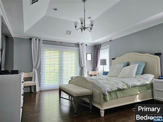 bedroom with visible vents, a raised ceiling, ornamental molding, dark wood-style flooring, and an inviting chandelier